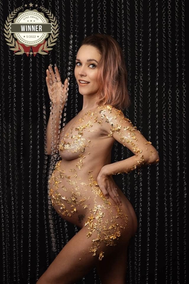 Pregnant Momma to be covered in gold foil surrounded by chains, taken by maternity photographer Sutton Coldfield birmingham
