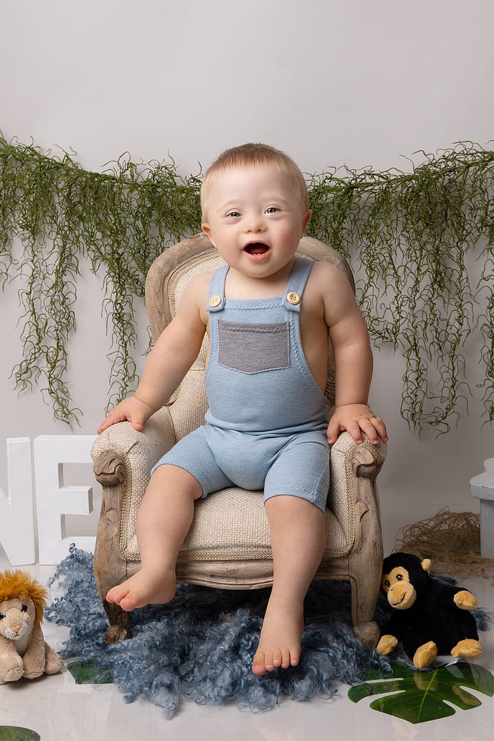 Birthday boy dressed in blue posing beautifully for his photos in Birmingham photography studio.