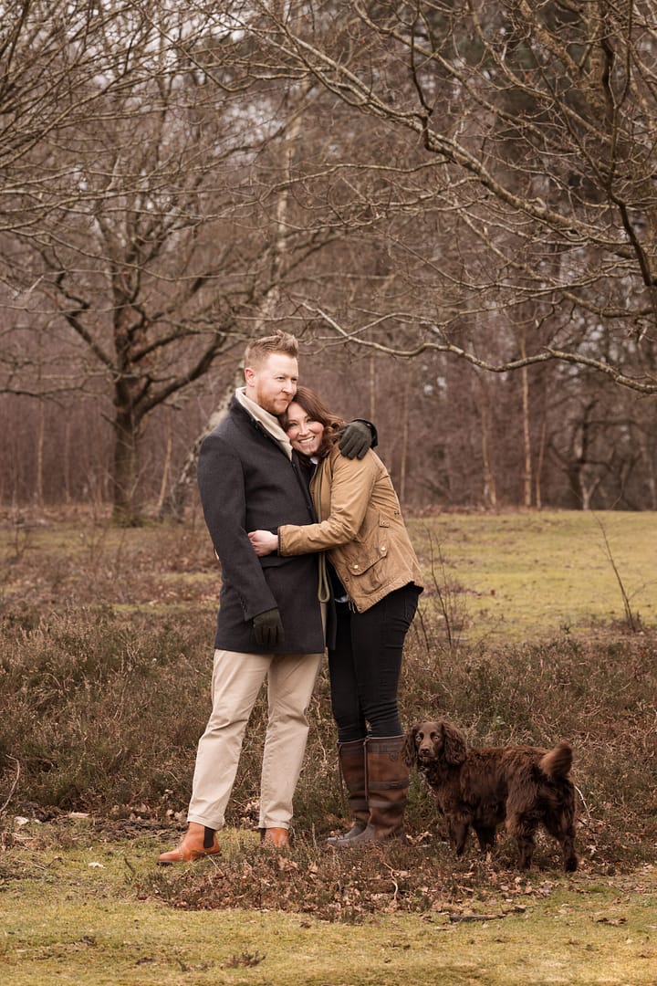 Couple outdoors in Sutton Park with their dog, taken by family photographer Sutton Coldfield Birmingham